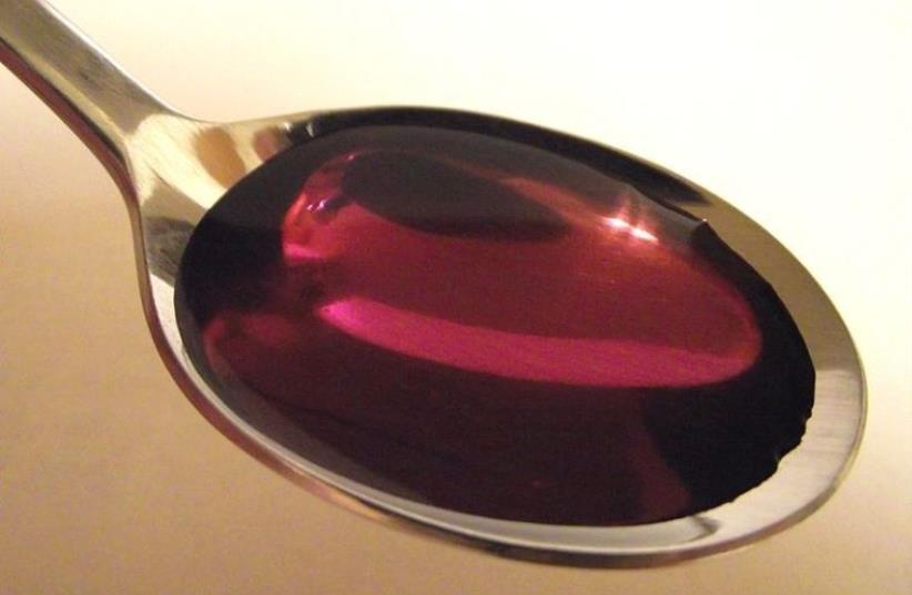 Cough syrup [Illustrative] (photo credit: WIKIMEDIA COMMONS/STICKPEN)