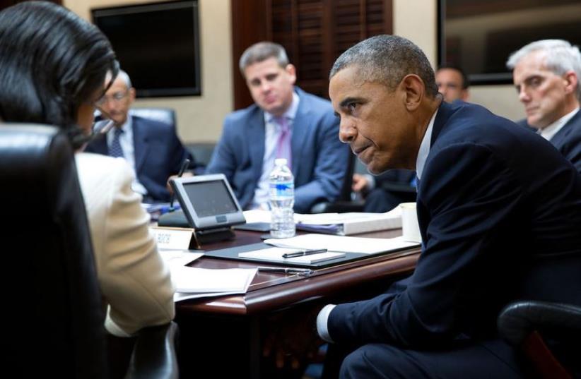 President Barack Obama listens to National Security Advisor Susan E. Rice during a National Security Council meeting in the White House (photo credit: OFFICIAL WHITE HOUSE PHOTO / PETE SOUZA)