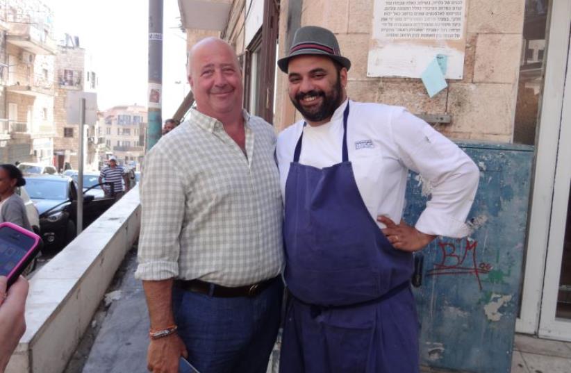 ANDREW ZIMMERN (left) and Uri Navon, chef at the Machneyuda restaurant in Jerusalem, pose for a photo in the capital on Tuesday. (Amy Spiro) (photo credit: AMY SPIRO)