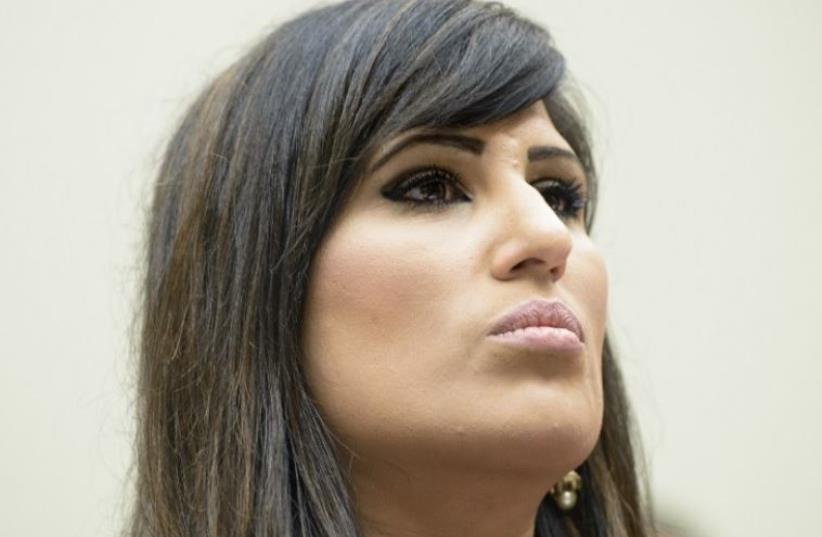  Nagameh Abedini, wife of Saeed Abedini, listens during a hearing of the Foreign Affairs Committee on Capitol Hill June 2, 2015.  (photo credit: BRENDAN SMIALOWSKI / AFP)