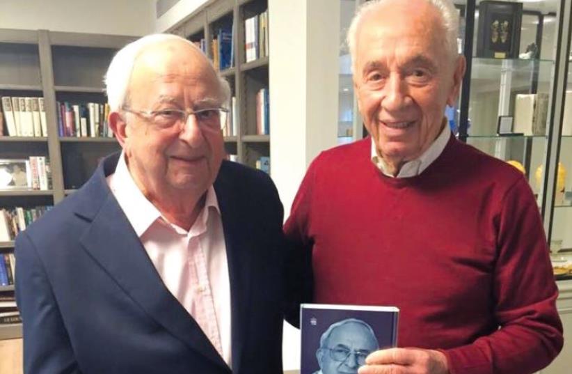 Yitzhak Navon (left) with Shimon Peres, after Navon presented Peres with a copy of his autobiography. (photo credit: Courtesy)