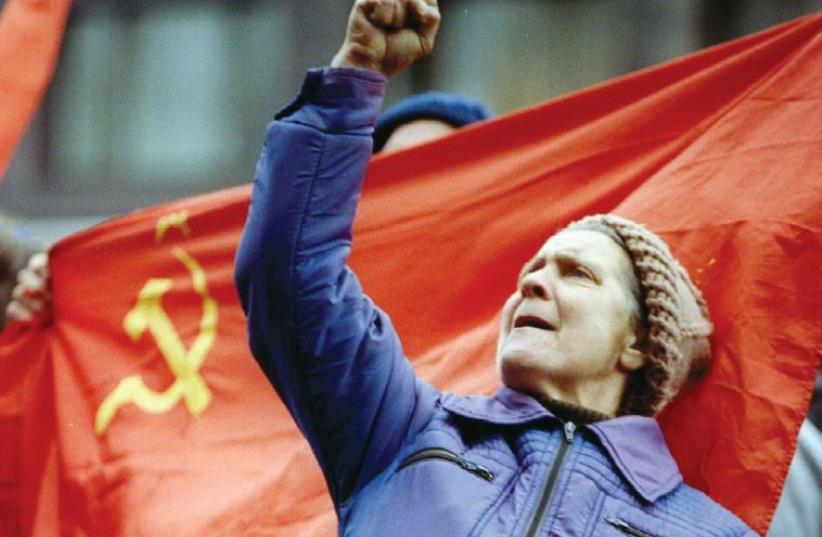 A Russian woman gestures during a pro-communist demonstration in Moscow in 1993. (photo credit: REUTERS)