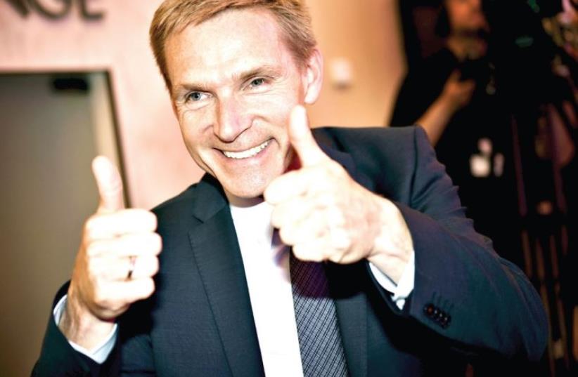 Danish People’s Party leader Kristian Thulesen Dahl expresses his jubilation after the Danish elections (photo credit: LINDA KASTRUP / REUTERS)