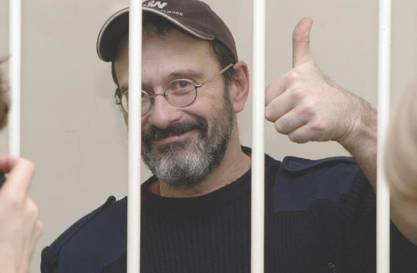 Dima Litvinov behind bars (photo credit: GREENPEACE)