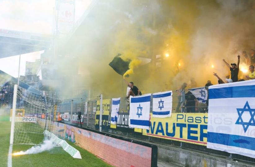 The behavior of Beitar Jerusalem fans in the Europa League qualifier in Charleroi, Belgium last Thursday has resulted in owner Eli Tabib  putting the club up for sale (photo credit: UDI ZITIAT/BSL,ADI AVISHAI)