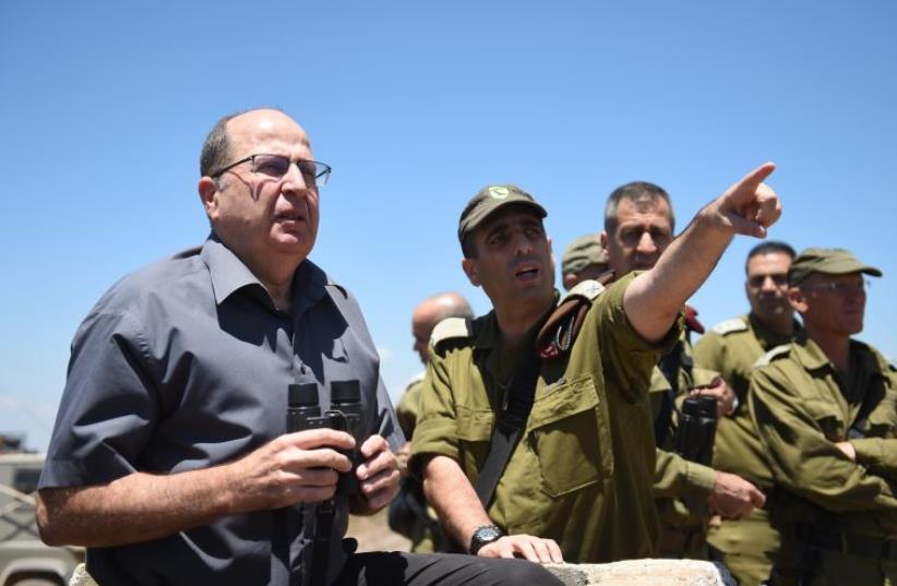 Defense Minister Moshe Ya'alon is briefed by IDF officers on the Golan Heights (photo credit: DEFENSE MINISTRY)