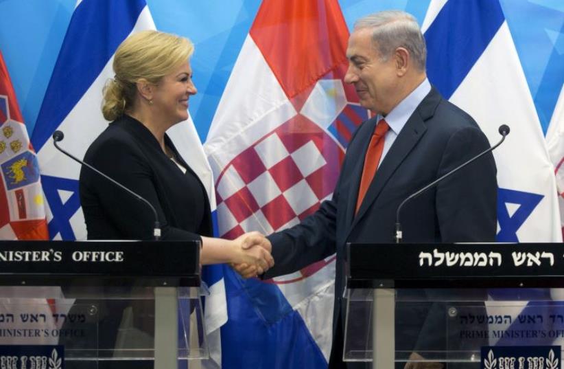 Prime Minister Benjamin Netanyahu (R) and Croatian President Kolinda Grabar-Kitarovic (photo credit: REUTERS)
