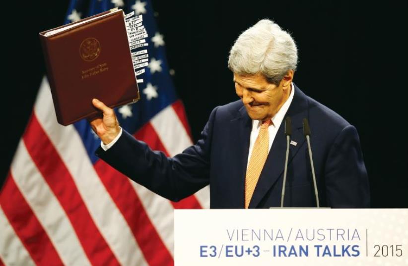 US secretary of State John Kerry reacts as he delivers a statement on the Iran talks deal at the Vienna International Center in Vienna, Austria, on July 14. (photo credit: LEONHARD FOEGER / REUTERS)