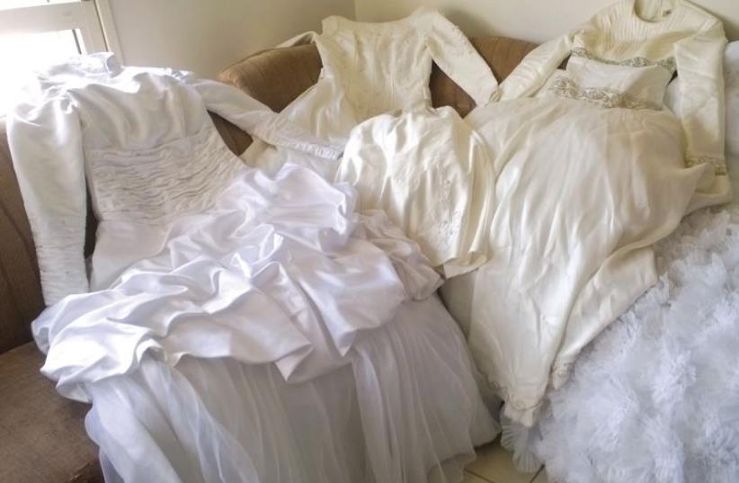 Wedding dresses awaiting their brides. (photo credit: SHOSHANAH SHEAR)