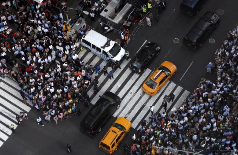 Some of several thousand protestors crowd into 7th Avenue at 42nd street as they demonstrate during a rally opposing the nuclear deal with Iran in Times Square (photo credit: REUTERS)
