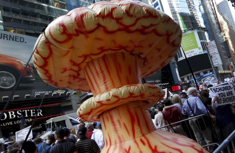 An inflatable mushroom cloud stands among demonstrators during a rally opposing the nuclear deal with Iran in Times Square (photo credit: REUTERS)