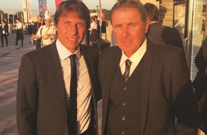 Israel national team coach Eli Gutman (right) met Italy coach Antonio Conte at Konstantin Palace outside of St. Petersburg yesterday (photo credit: ISRAEL FOOTBALL ASSOCIATION, COURTESY)