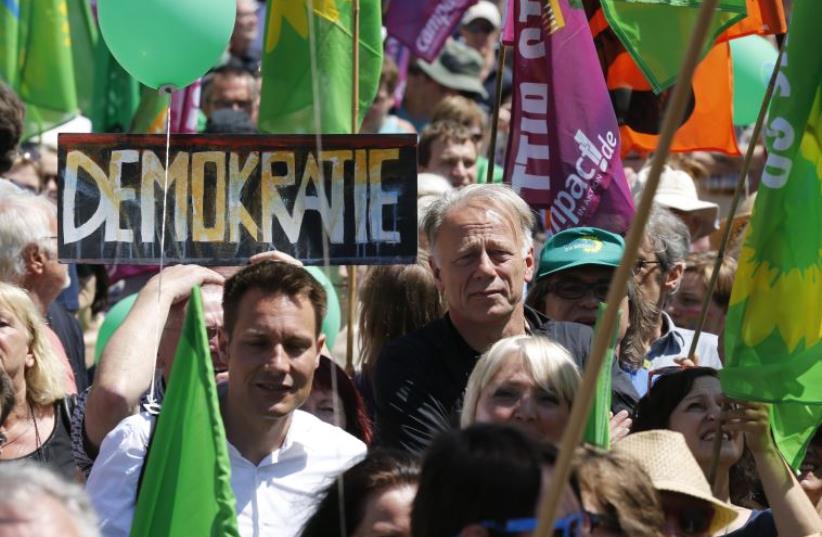 German Green Party activists at a rally in Munich (photo credit: REUTERS)