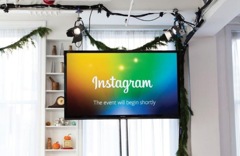 A SCREEN displays a ‘This event will begin shortly’ message before Instagram CEO and co-founder Kevin Systrom announced the launch of a new service named Instagram Direct in New York in 2013 (photo credit: REUTERS)