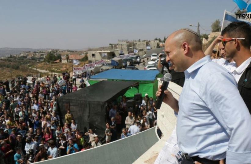 Education Minister Naftali Bennett addresses crowd at Beit El settlement (photo credit: TAZPIT)