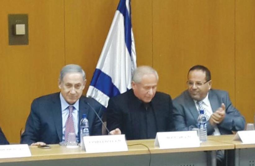 Netanyahu, Likud Deputy Minister Ayoub Kara (right), and MK Avi Dichter meet with Druse students in the Knesset on Monday. (photo credit: Courtesy)