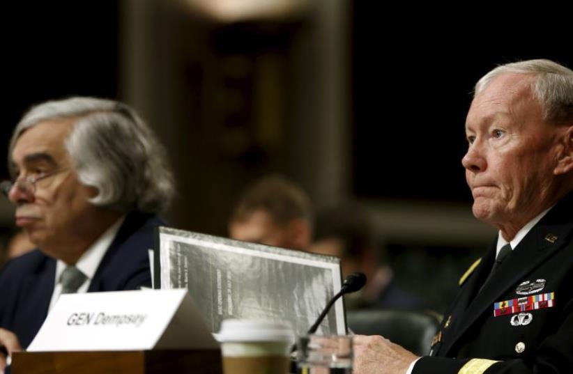 The Chairman of the Joint Chiefs of Staff, U.S.Army General Martin Dempsey (R), along with Energy Secretary Ernest Moniz, (L), appear before the Senate Armed Services Committee in Washington July 29, 2015.  (photo credit: REUTERS)