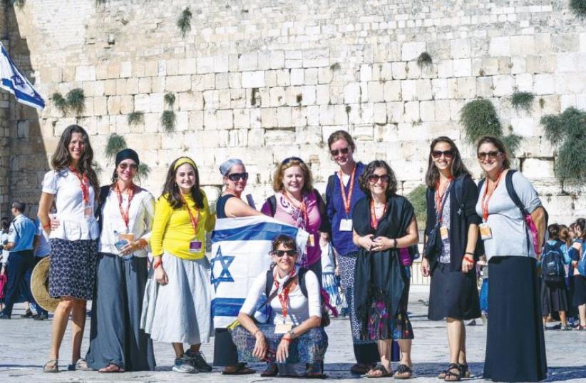 the women receive a personalized prayer book and visit the Western Wall as part of ‘MOMentum.’ (photo credit: AVIRAM VALDMAN)
