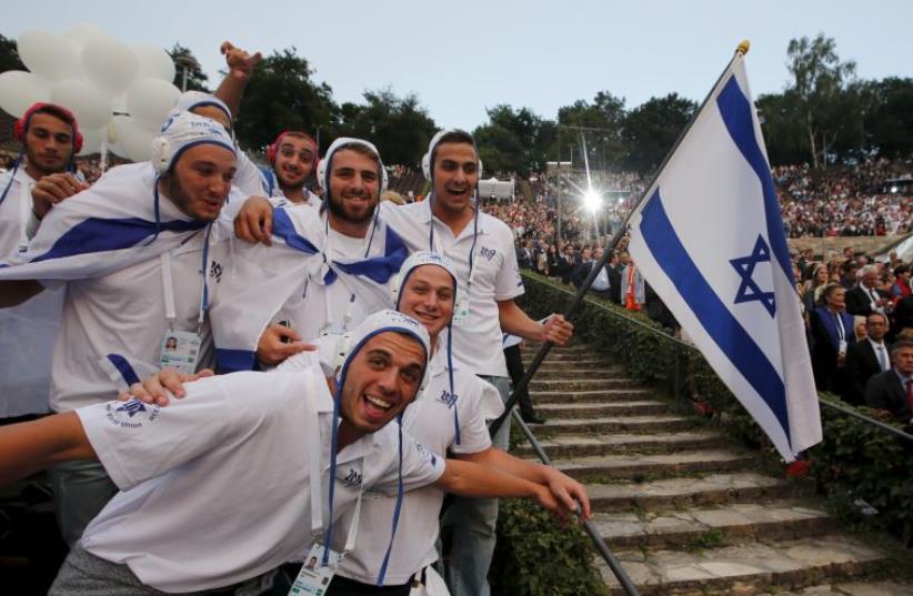 Athletes of the Israeli team arrive for the opening cermony of the 14th European Maccabi Games in Berlin, Germany July 28, 2015 (photo credit: REUTERS)
