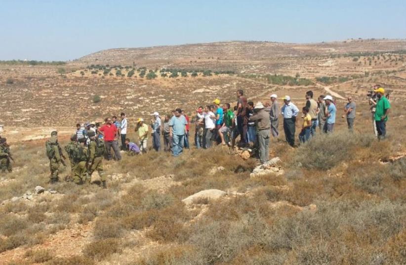 Scene of settler fight with Palestinians near Esh Kodesh, August 1, 2015 (photo credit: TAZPIT)