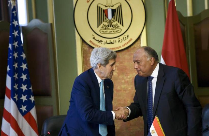 US Secretary of State John Kerry (L) shakes hands with Egyptian Foreign Minister Sameh Shukri following a news conference after meetings at the Ministry of Foreign Affairs in Cairo August 2, 2015 (photo credit: REUTERS)