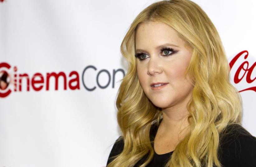Actress Amy Schumer poses during the CinemaCon Big Screen Achievement Awards at Caesars Palace in Las Vegas (photo credit: REUTERS)