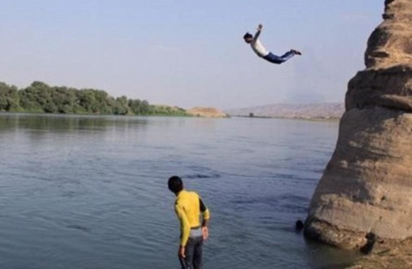 ISIS tourism brochure touts cliff jumping (photo credit: ARAB MEDIA)
