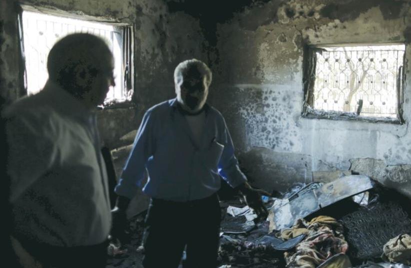 the Dawabsha house which was set on fire in a suspected attack by Jewish extremists in Duma. (photo credit: AMMAR AWAD / REUTERS)