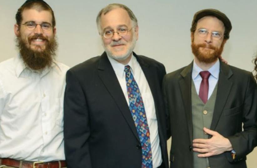 Rabbi Herzl Hefter (second from left), rosh yeshiva of the Har El Beit Midrash, with the recent graduating class. (photo credit: SIGAL KRIMOLOVSKI)
