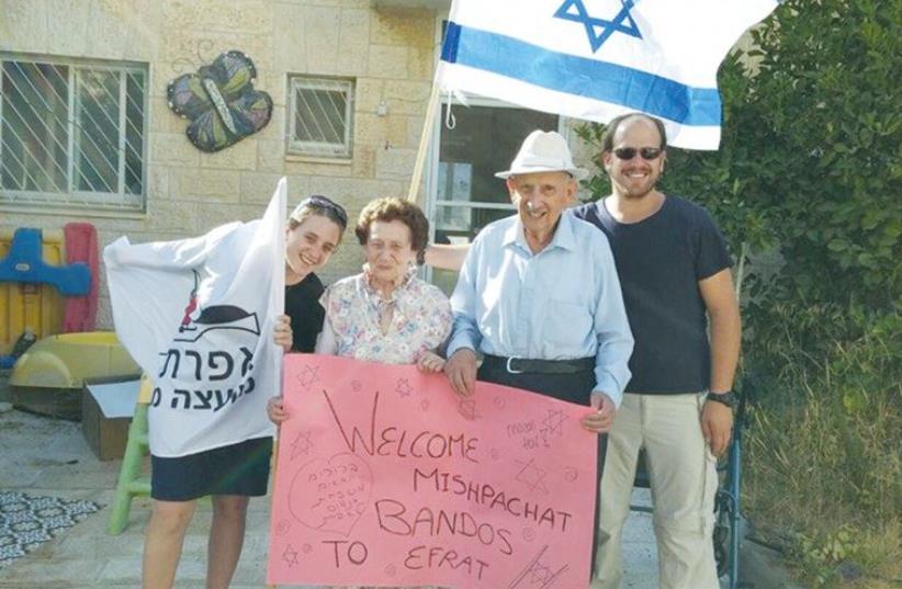 FEIGA AND FELIX BANDOS are welcomed by their family to Efrat last week. (photo credit: EFRAT LOCAL COUNCIL)