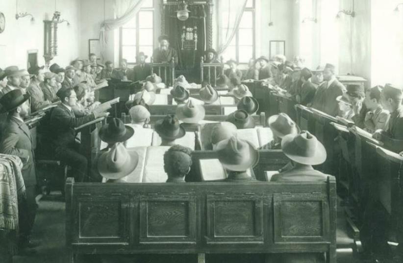 A historic photo hanging in the ‘beit midrash’ (study hall) depicts Rabbi Abraham Isaac Hacohen Kook giving a talk (photo credit: Courtesy)