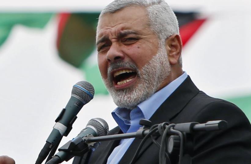 Ismail Haniyeh talks to his supporters during a Hamas rally in Gaza City (photo credit: REUTERS)