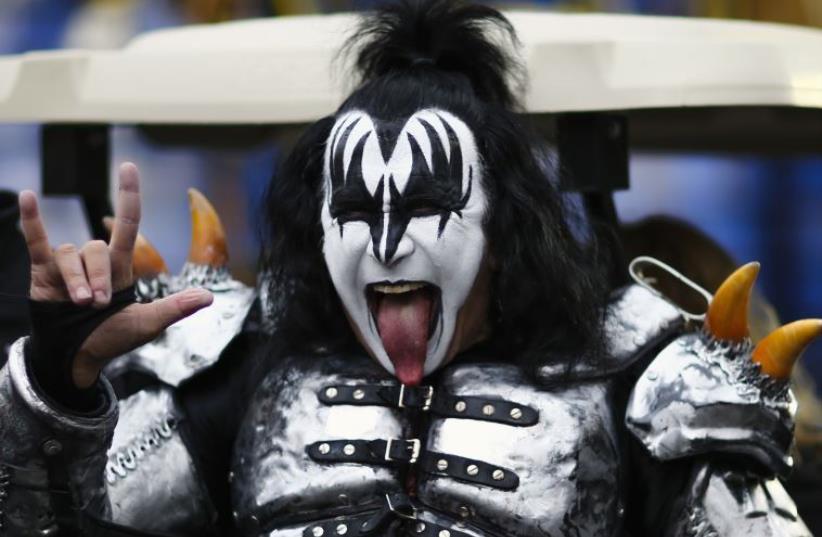 Gene Simmons of KISS gestures as he attends the 88th Macy's Thanksgiving Day Parade in New York (photo credit: REUTERS)
