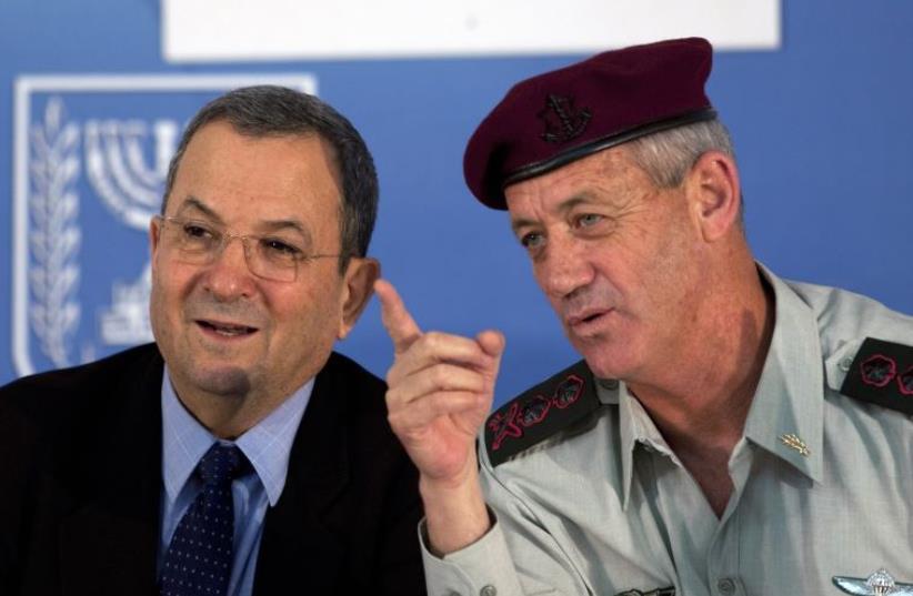 Then-IDF chief Benny Gantz (R) speaks with then-defense minister Ehud Barak in Jerusalem (photo credit: REUTERS)