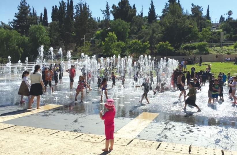 Cooling off in Teddy Park’s fountain water show (photo credit: FUN IN JERUSALEM)