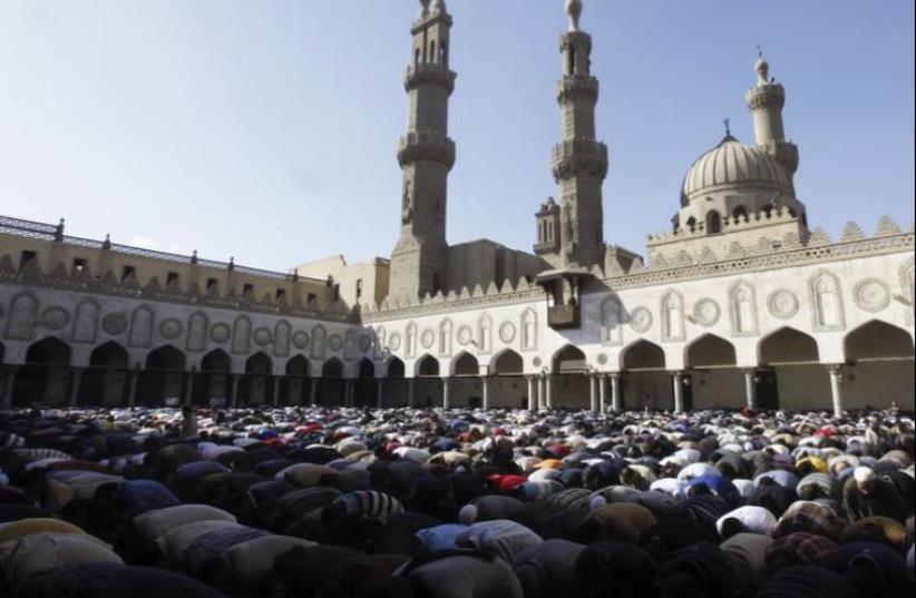 Egyptians attend Friday prayers at Al Azhar mosque in Cairo (photo credit: REUTERS)