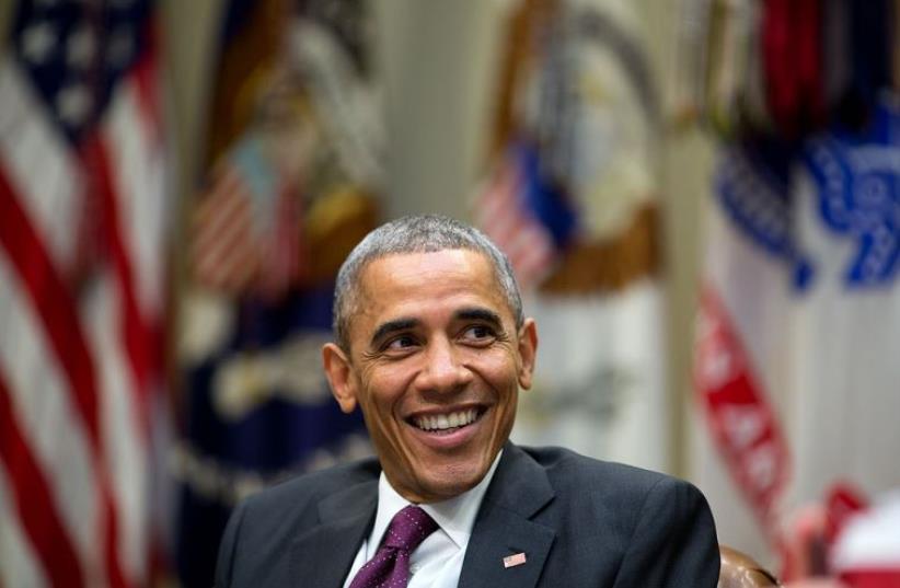 US President Barack Obama laughs during a meeting at the White House (photo credit: OFFICIAL WHITE HOUSE PHOTO / PETE SOUZA)