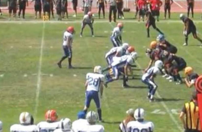 PLAYING IN Madrid in its first-ever official game, the Israel national tackle football team (in blue and white) earned a 28-20 victory over Spain, August 30, 2015 (photo credit: E.GERSHTEIN)
