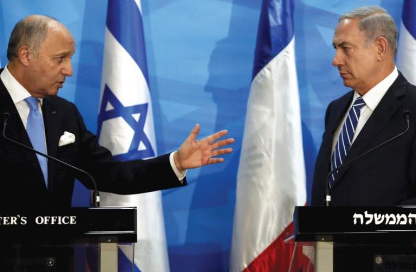 French Foreign Minister Laurent Fabius presents Europe's position to Prime Minister Benjamin Netanyahu in Jerusalem, June 21 (photo credit: THOMAS COEX / REUTERS)
