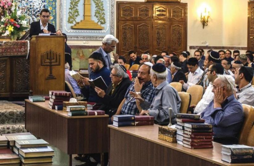 Iranian Jews celebrate Rosh Hashana last year at the Yusef Abad Synagogue in Tehran (photo credit: OLEKSANDR RUPETA / AFP)
