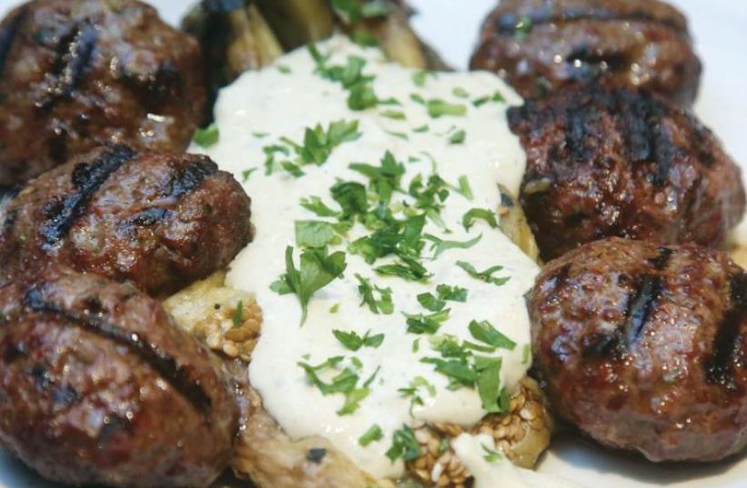 Mince kebabs served with eggplant and tehina; (photo credit: MARC ISRAEL SELLEM/THE JERUSALEM POST)