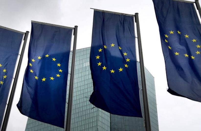 EU flags (photo credit: AFP/ DANIEL ROLAND)