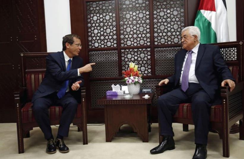 Zionist Union leader Isaac Herzog’s meeting with Palestinian Authority President Mahmoud Abbas in Ramallah (photo credit: MOHAMAD TOROKMAN/REUTERS)