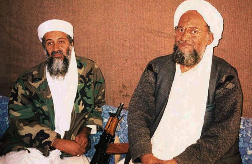 al-Qaida cheif Ayman al-Zawahiri sits with predecessor Osama Bin Laden during an interview in 2001  (photo credit: REUTERS)