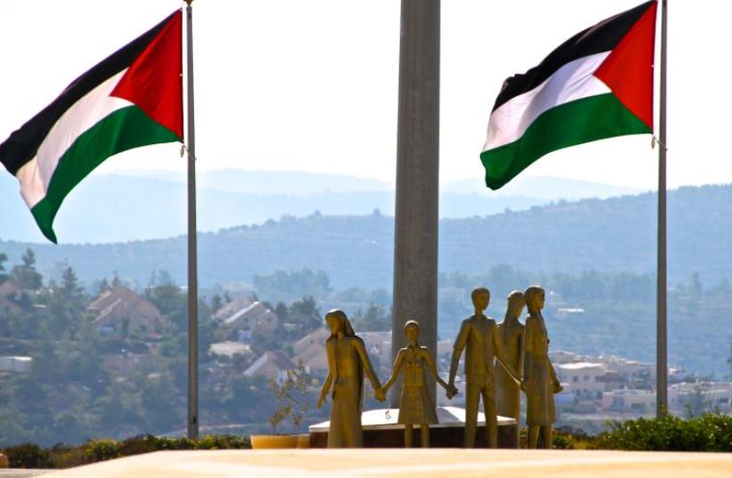 Palestinian flags flying by the Rawabi visitor center in the West Bank (photo credit: TOVAH LAZAROFF)
