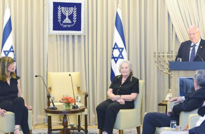President Reuven Rivlin greets outgoing Israel Academy of the Sciences and Humanities president Prof. Ruth Arnon (center) and her successor, Prof. Nili Cohen, at his residence (photo credit: GPO)