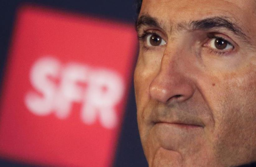 Patrick Drahi, Franco-Israeli businessman, attends a news conference in Paris (photo credit: REUTERS)