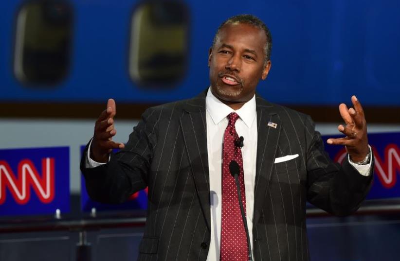 Republican presidential hopefuls, retired neurosurgeon Ben Carson gestures while speaking during the Republican presidential debate at the Ronald Reagan Presidential Library in Simi Valley, California on September 16, 2015.  (photo credit: FREDERIC J BROWN / AFP)
