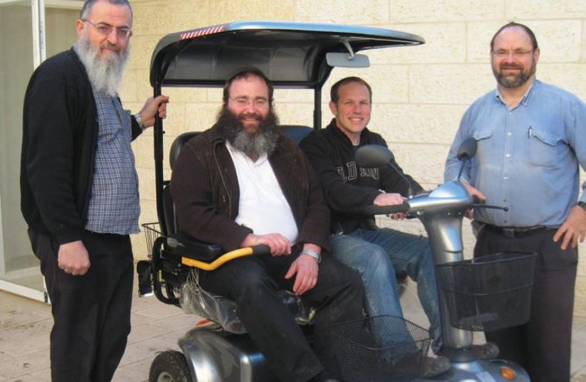 Electric scooter modified for Shabbat, with the Zomet’s rabbis and engineers (photo credit: DAVID DOITSCH OF ZOMET)