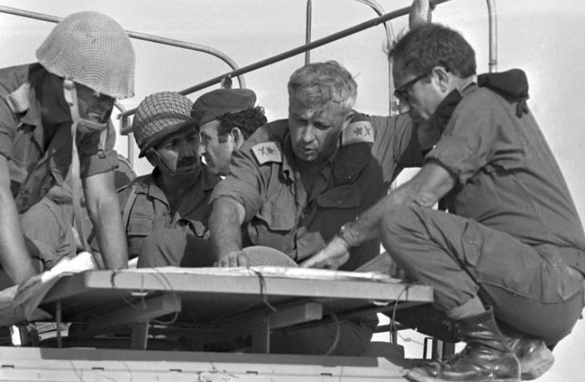 Ariel Sharon (2nd R) confers with comrades during the 1973 Yom Kippur War, October 10, 1973 (photo credit: REUTERS/SHLOMO ARAD/GPO)